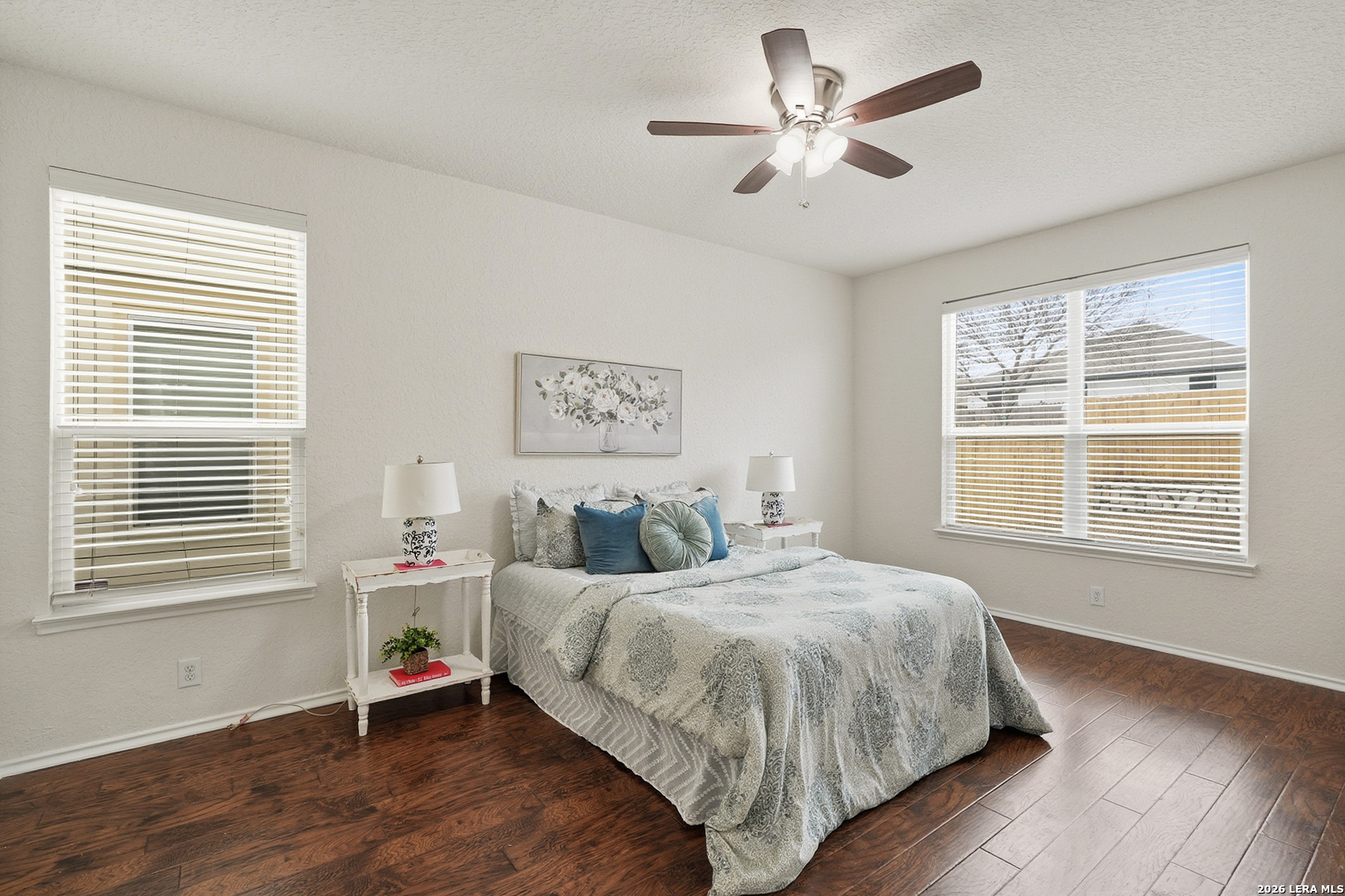 9519 Gold Stage Road San Antonio, TX 78254 - Photo 12 of 25 a bedroom with a bed and a large window