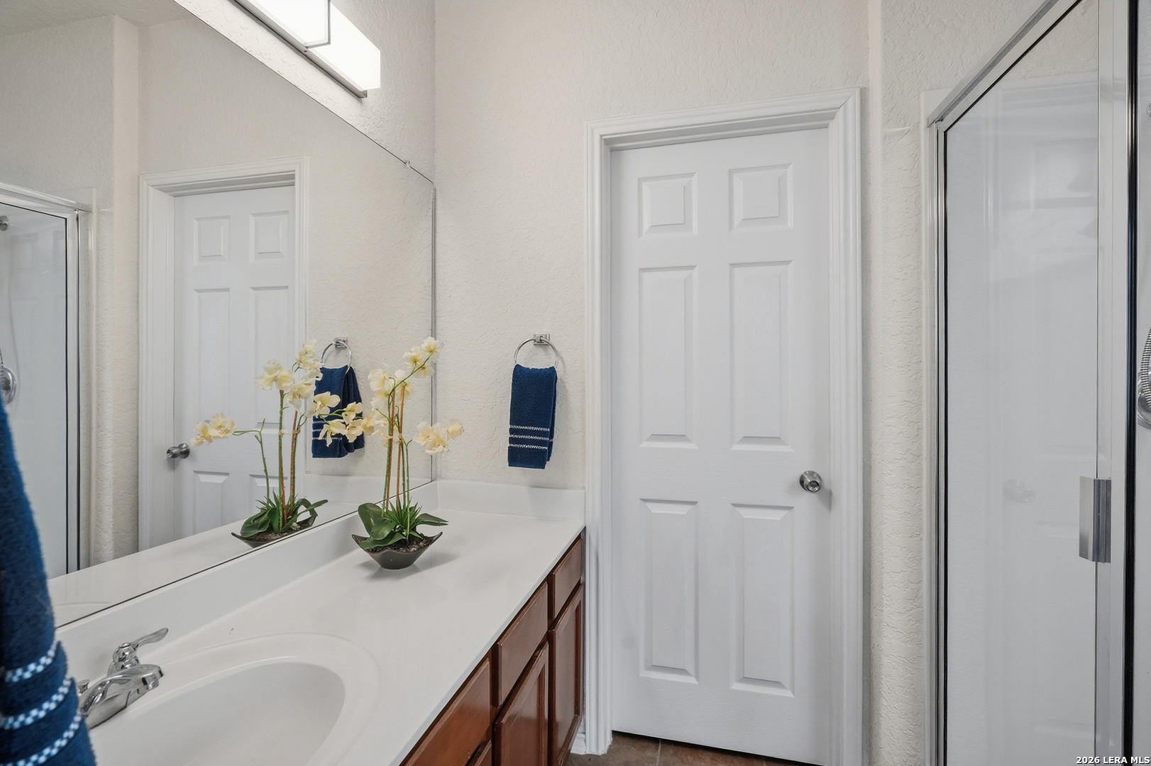 9519 Gold Stage Road San Antonio, TX 78254 - Photo 13 of 25 a bathroom with a sink and a mirror