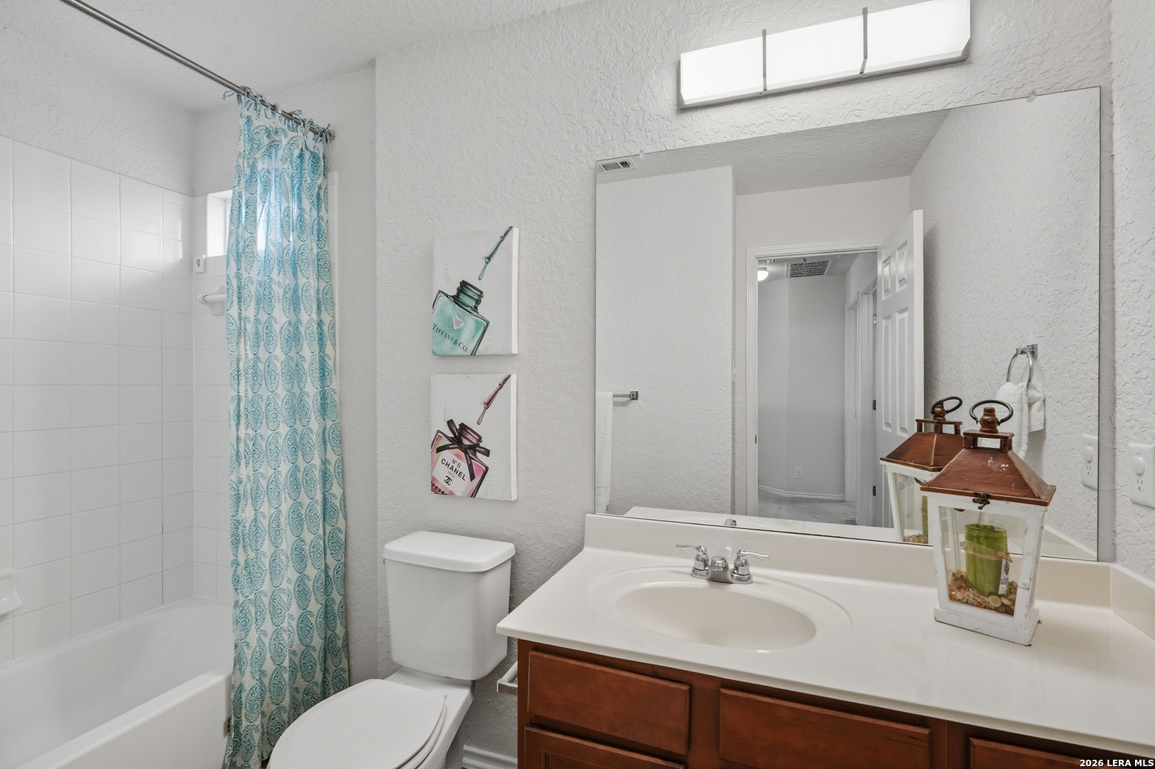 9519 Gold Stage Road San Antonio, TX 78254 - Photo 20 of 25 a bathroom with a sink toilet and shower
