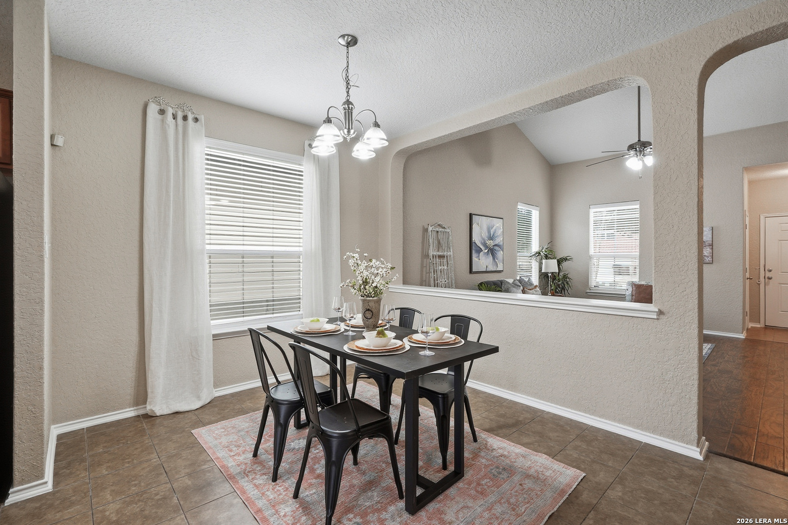 9519 Gold Stage Road San Antonio, TX 78254 - Photo 10 of 25 a view of a dining room with furniture window and wooden floor