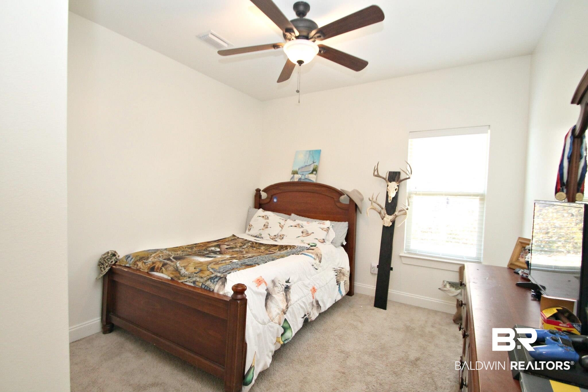 30232 Persimmon Drive Daphne, AL 36527 - Photo 15 of 27 Bedroom featuring visible vents, baseboards, and light colored carpet