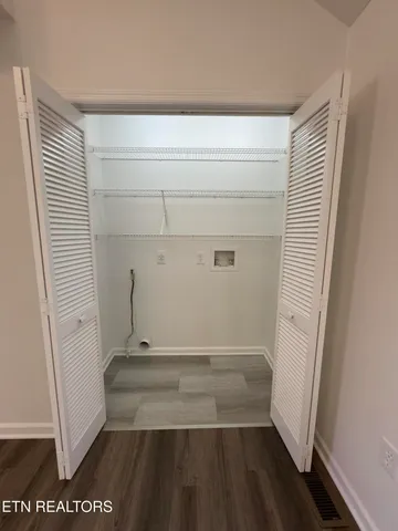 a kitchen with stainless steel appliances a stove sink microwave and cabinets