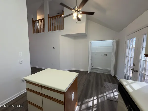 a view of walk in closet with wooden floor