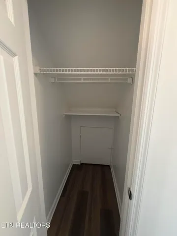 a bathroom with a glass door shower