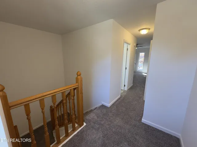 a view of a hallway with a livingroom