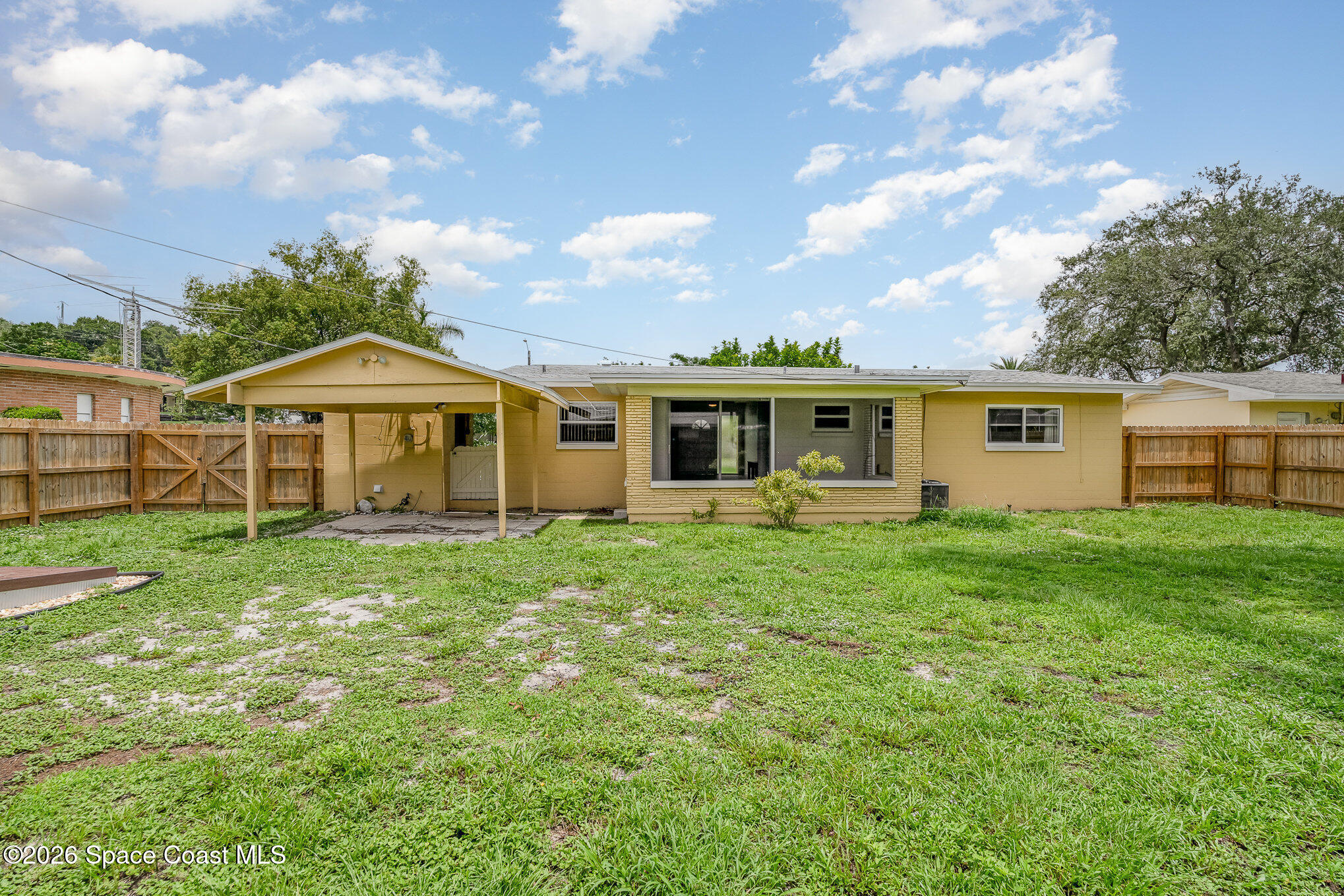115 Gary Lane Cocoa, FL 32922 - Photo 23 of 29 a view of a house with a backyard