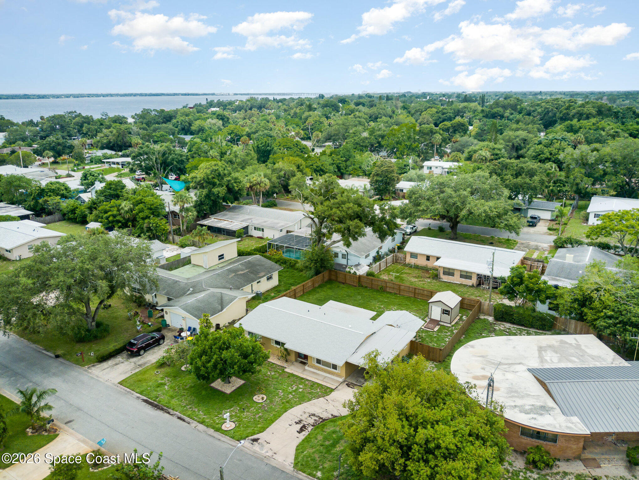 115 Gary Lane Cocoa, FL 32922 - Photo 27 of 29 an aerial view of multiple houses with yard