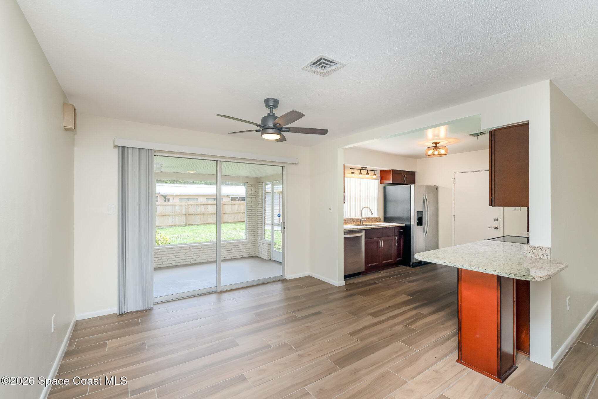 115 Gary Lane Cocoa, FL 32922 - Photo 6 of 29 a kitchen with stainless steel appliances a sink and a large window
