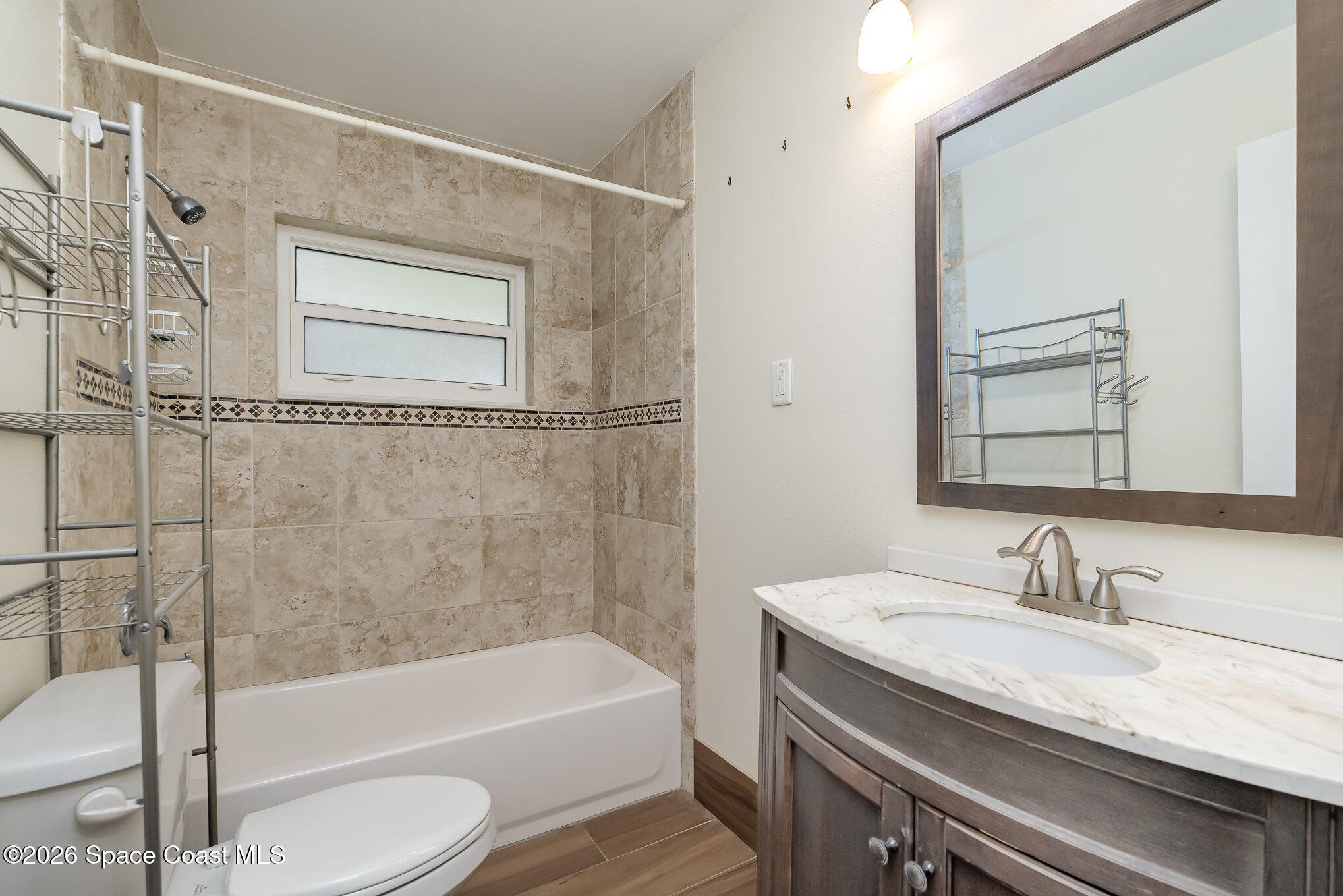 115 Gary Lane Cocoa, FL 32922 - Photo 10 of 29 a bathroom with a granite countertop sink toilet and shower