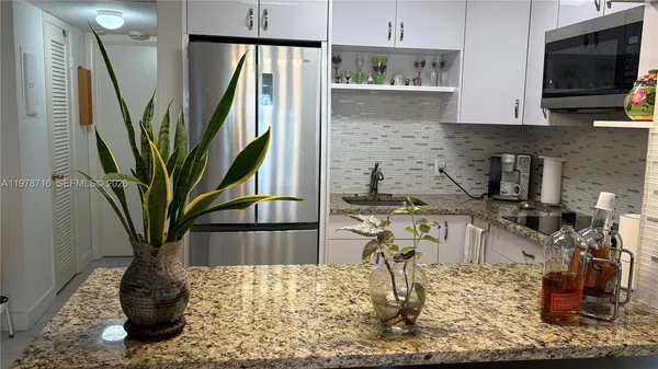 a vase of flowers sitting on a table