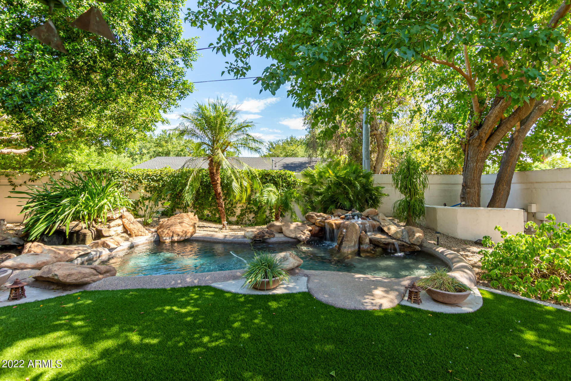 625 West Ocotillo Road Phoenix, AZ 85013 - Photo 2 of 55 a view of back yard of the house with green space and seating area