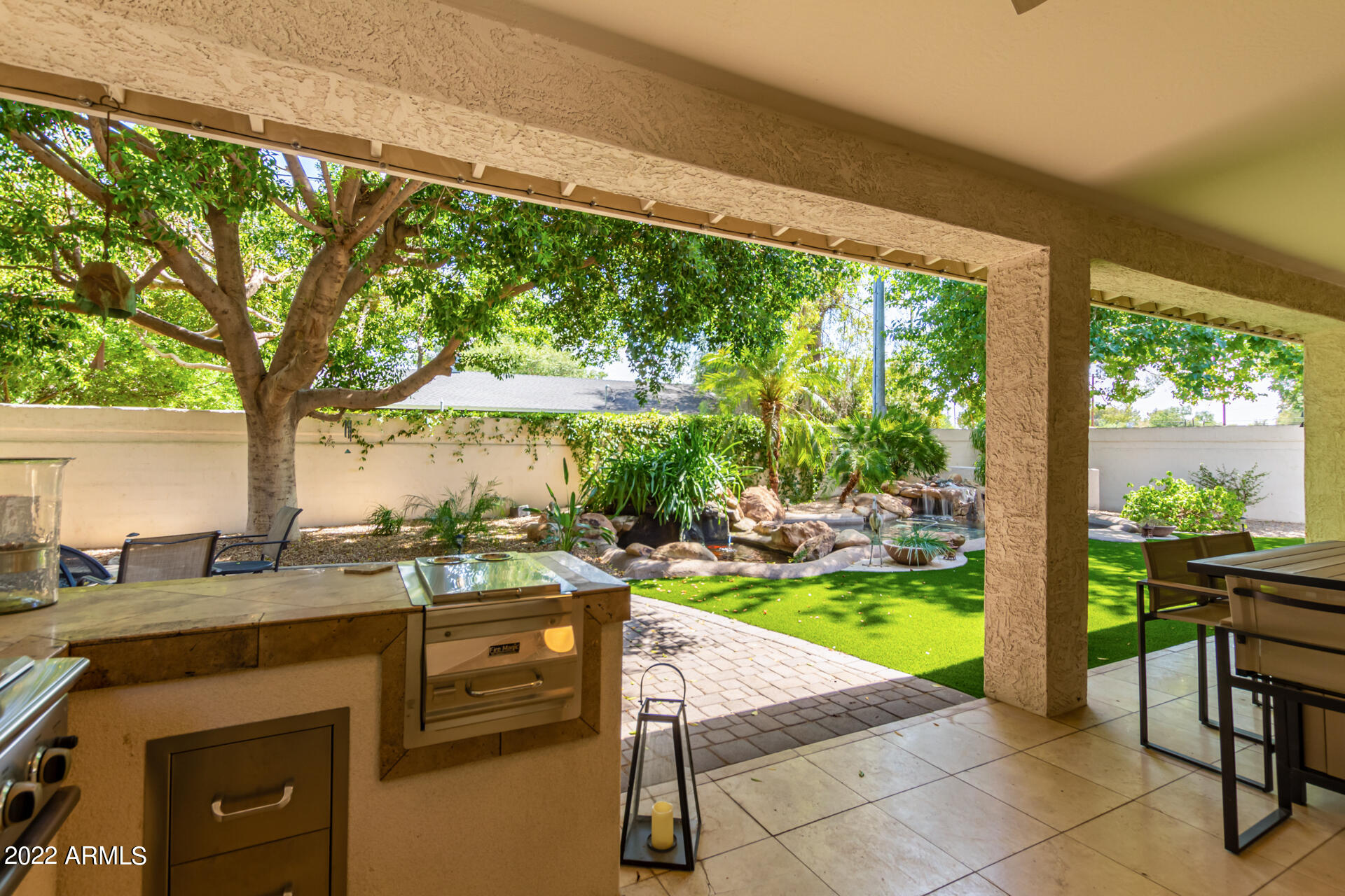 625 West Ocotillo Road Phoenix, AZ 85013 - Photo 39 of 55 a patio with table and chairs and couches with wooden floor and fence