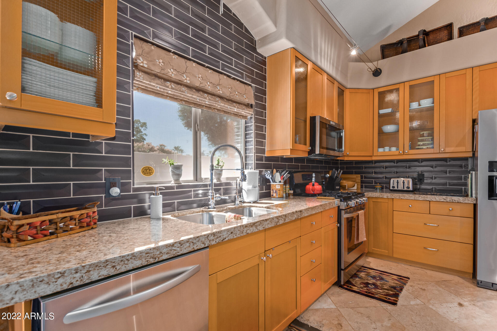 625 West Ocotillo Road Phoenix, AZ 85013 - Photo 4 of 55 a kitchen with stainless steel appliances granite countertop a sink and cabinets