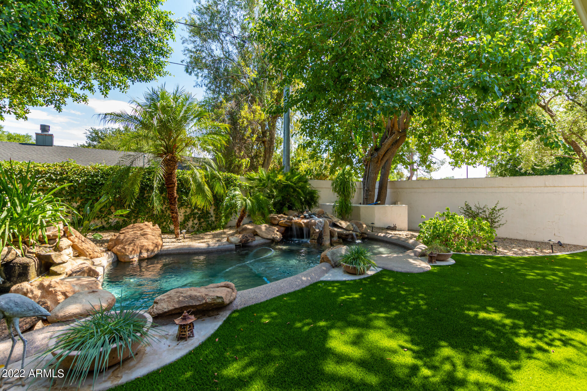 625 West Ocotillo Road Phoenix, AZ 85013 - Photo 42 of 55 a view of backyard with outdoor seating and green space