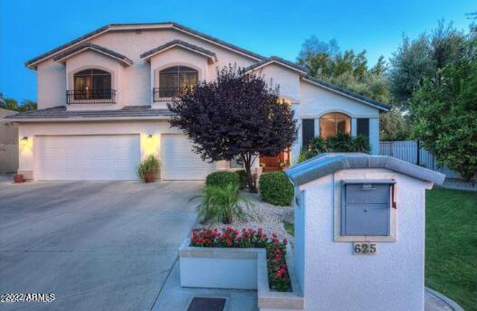 625 West Ocotillo Road Phoenix, AZ 85013 - Photo 50 of 55 a front view of a house with a garden