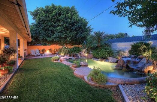 625 West Ocotillo Road Phoenix, AZ 85013 - Photo 53 of 55 a view of a table and chairs in the garden