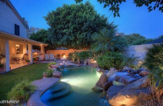 625 West Ocotillo Road Phoenix, AZ 85013 - Photo 54 of 55 a view of a swimming pool with a garden