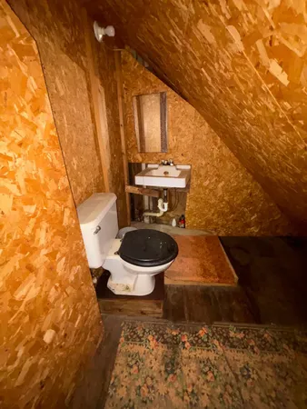 a bathroom with a toilet and a sink