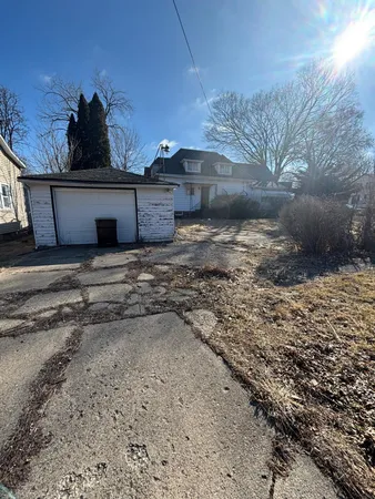a view of a backyard of the house