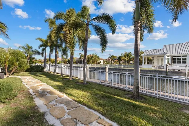 a view of a swimming pool with a bench in balcony