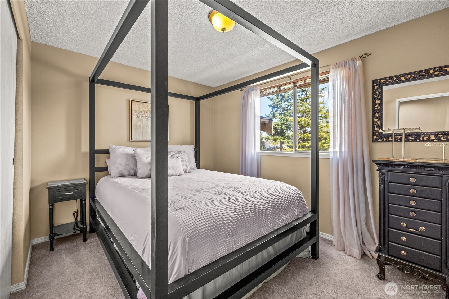 1601 Olympia Avenue Southeast Renton, WA 98058 - Photo 13 of 28 a bed room with a bed and a window