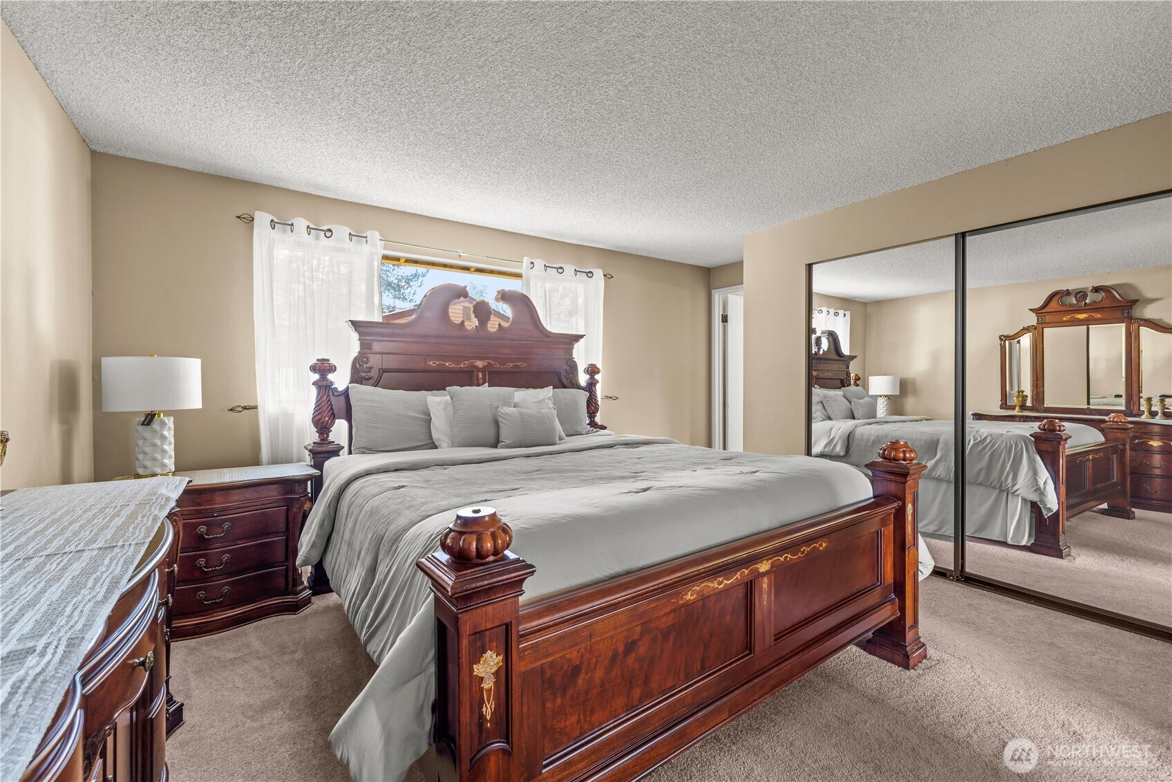 1601 Olympia Avenue Southeast Renton, WA 98058 - Photo 16 of 28 a bed room with a bed and a painting on the wall