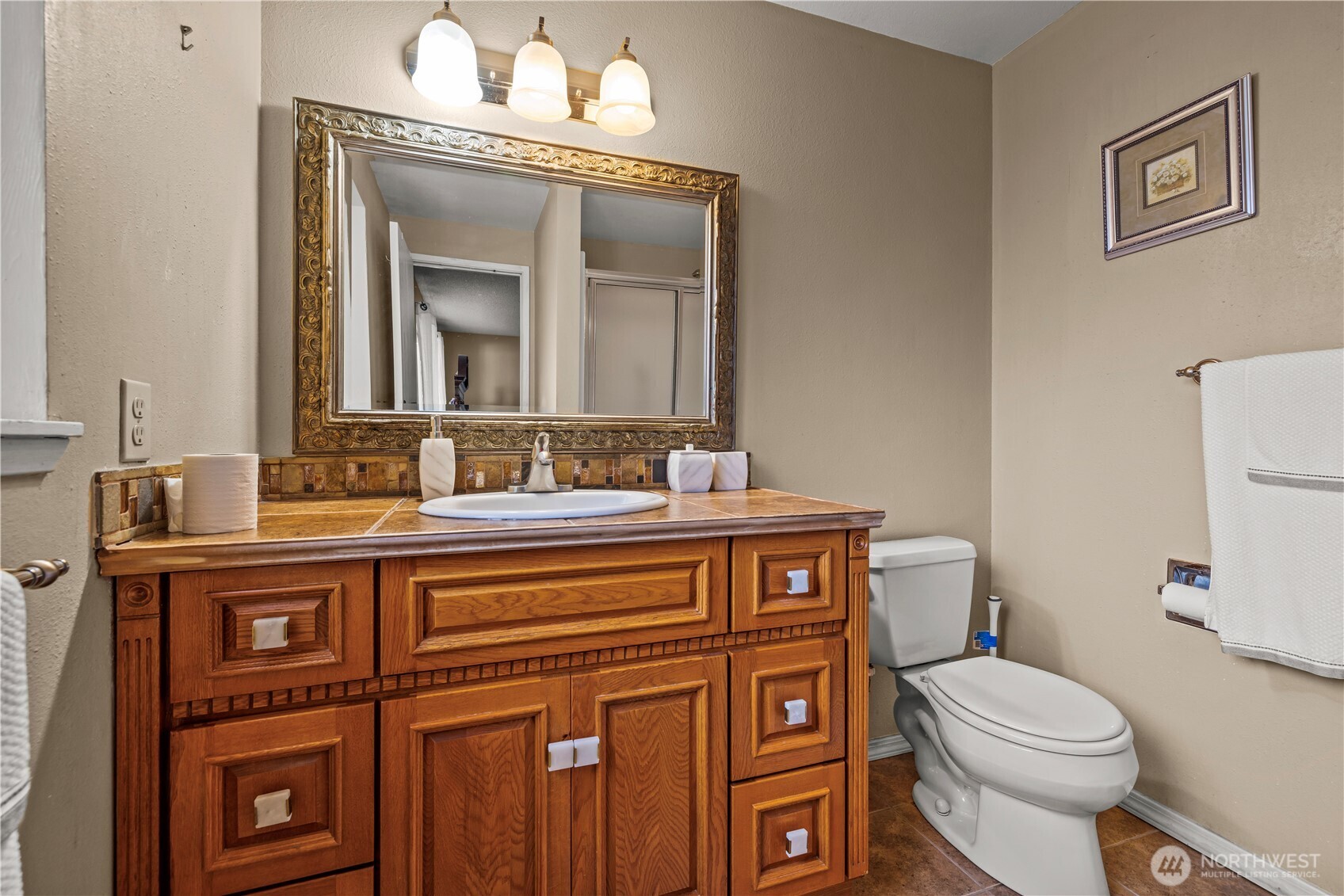 1601 Olympia Avenue Southeast Renton, WA 98058 - Photo 17 of 28 a bathroom with a toilet a sink and mirror