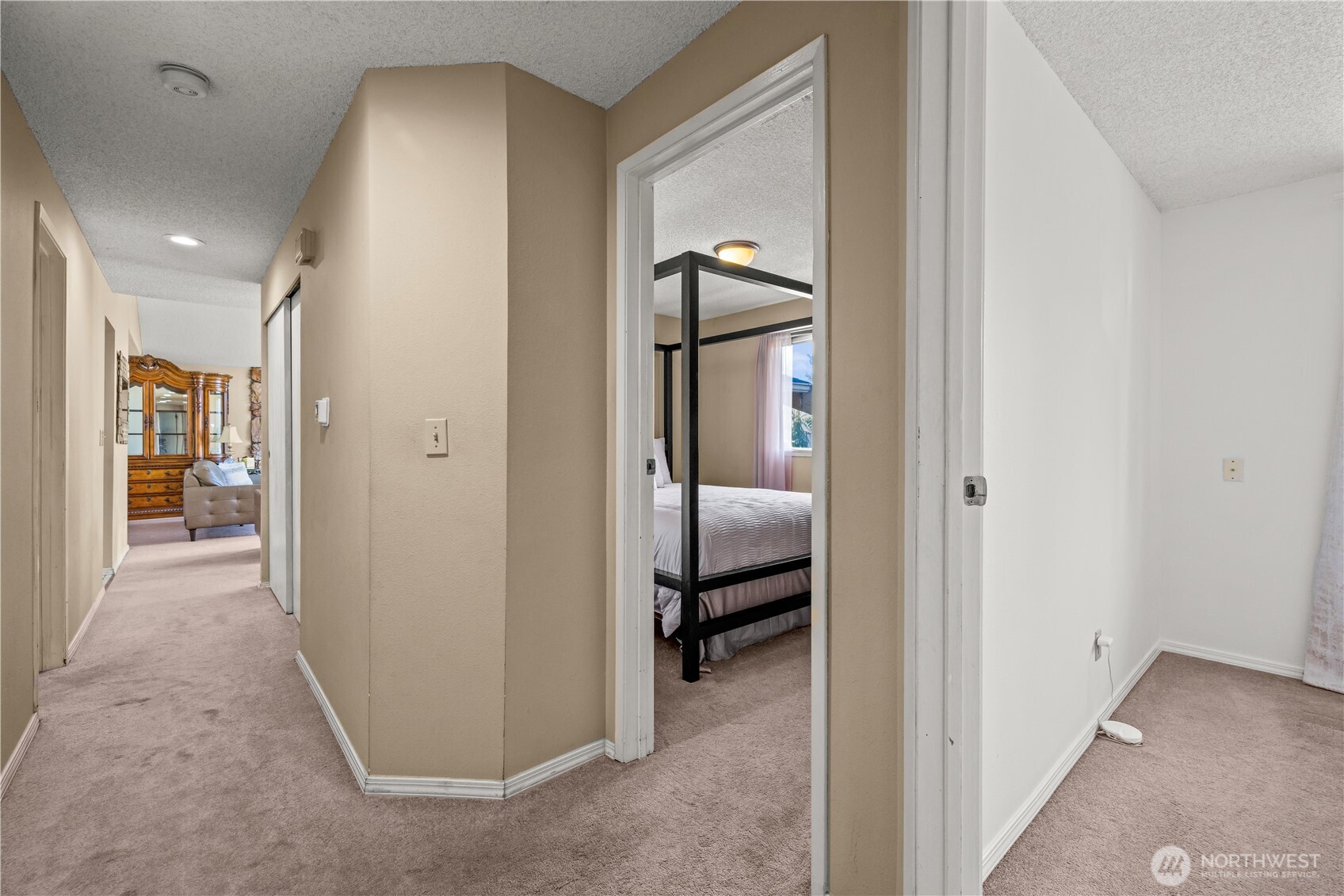 1601 Olympia Avenue Southeast Renton, WA 98058 - Photo 18 of 28 a view of a hallway with a livingroom and a bathroom