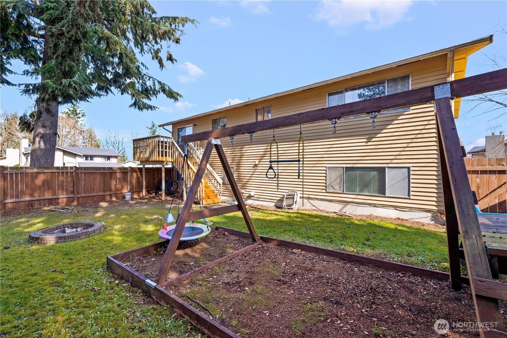 1601 Olympia Avenue Southeast Renton, WA 98058 - Photo 26 of 28 a backyard of a house with barbeque oven table and chairs