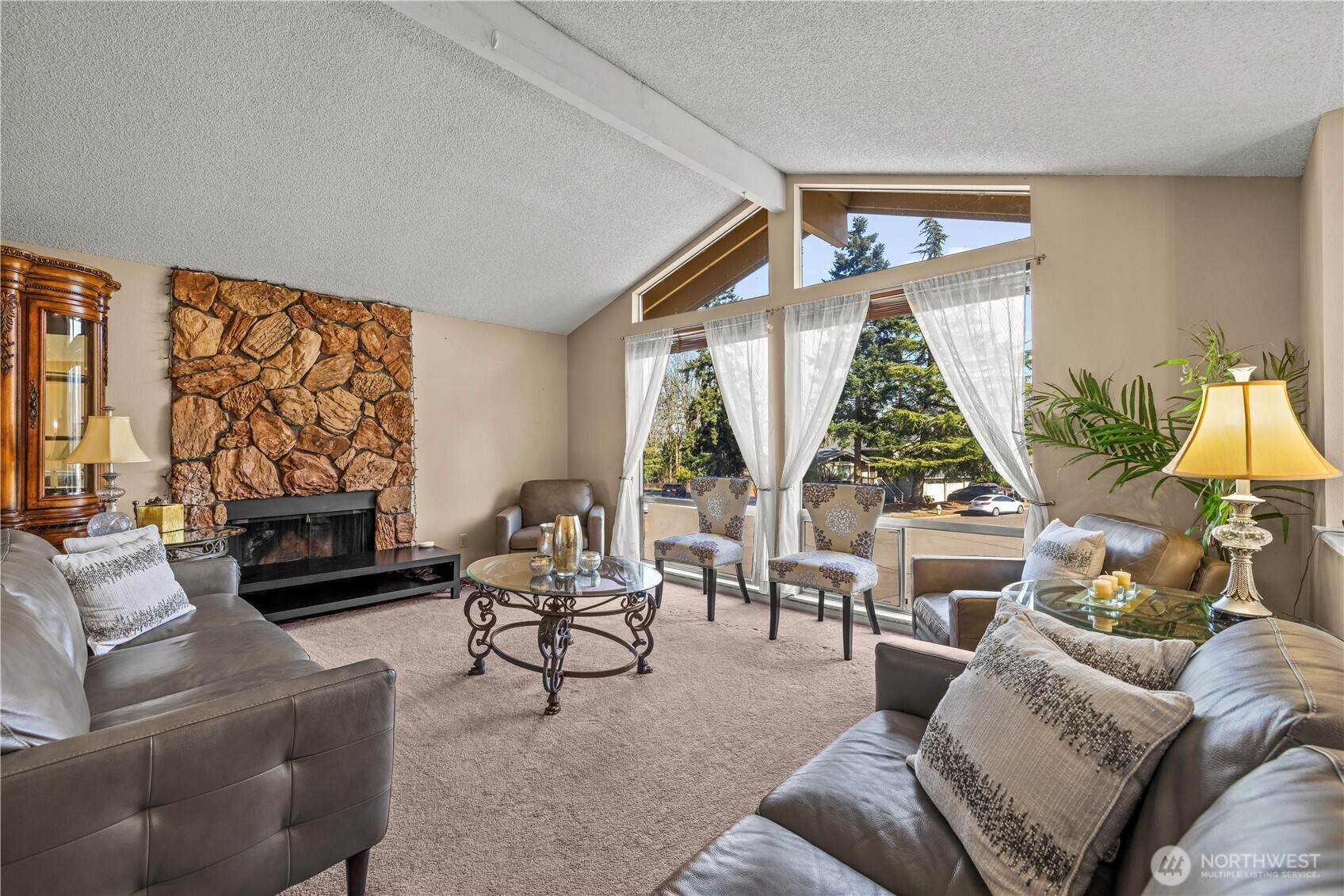 1601 Olympia Avenue Southeast Renton, WA 98058 - Photo 3 of 28 a living room with furniture a large window and a flat screen tv