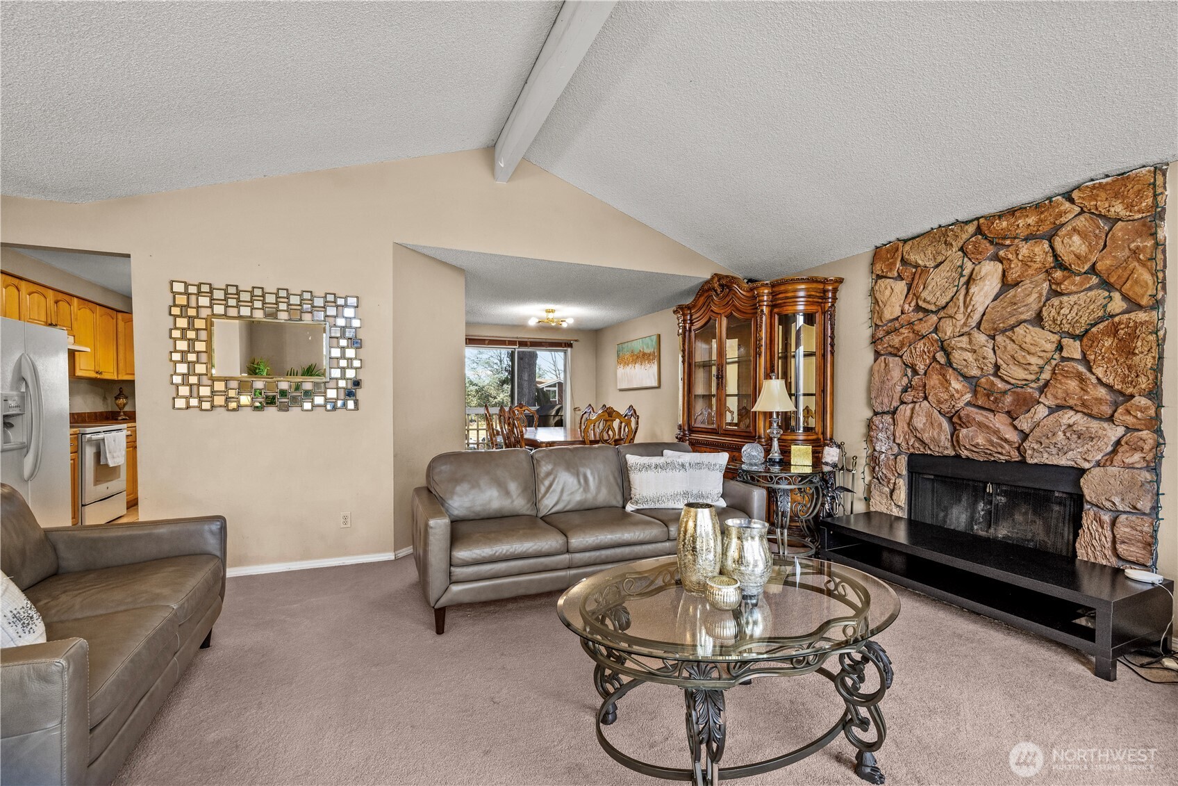 1601 Olympia Avenue Southeast Renton, WA 98058 - Photo 4 of 28 a living room with furniture a fireplace and a table