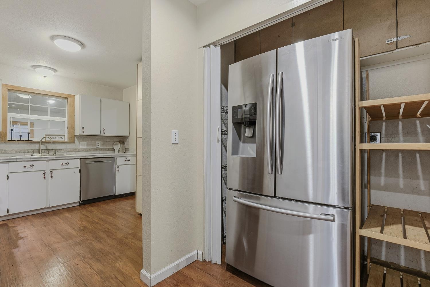 5855 Pine Street Foresthill, CA 95631 - Photo 14 of 32 a white refrigerator freezer sitting inside of a kitchen