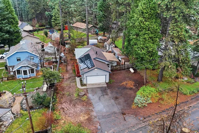 an aerial view of a house with a garden