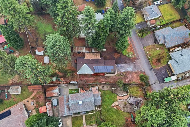 an aerial view of residential houses with outdoor space