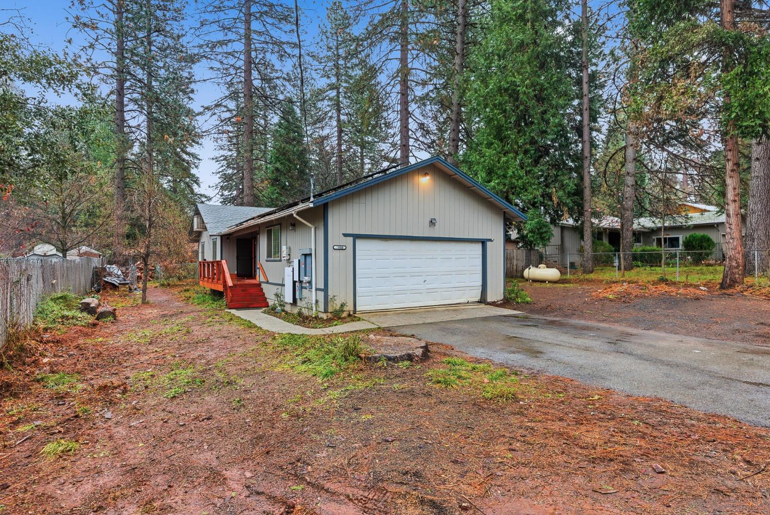 5855 Pine Street Foresthill, CA 95631 - Photo 5 of 32 a view of a house with backyard and trees