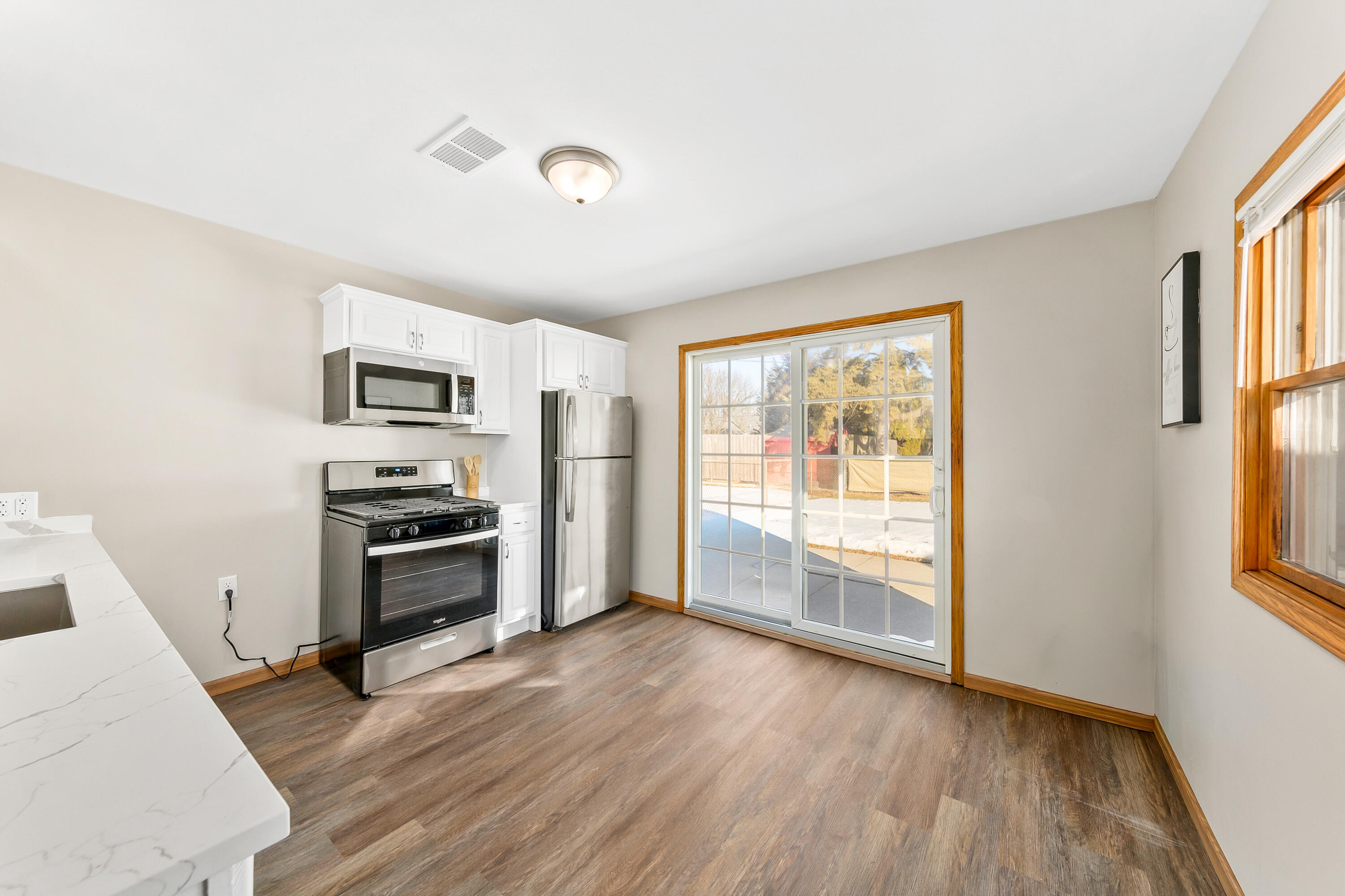 6136 West Oklahoma Avenue Milwaukee, WI 53219 - Photo 9 of 25 New SS range and microwave! New LVP floors!