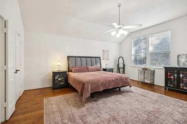 a bedroom with a bed closet and a window
