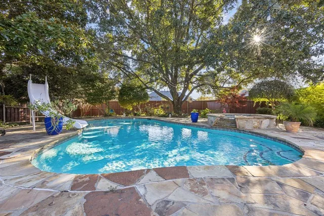 a view of a park with large trees