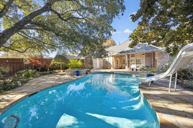 a view of a house with swimming pool