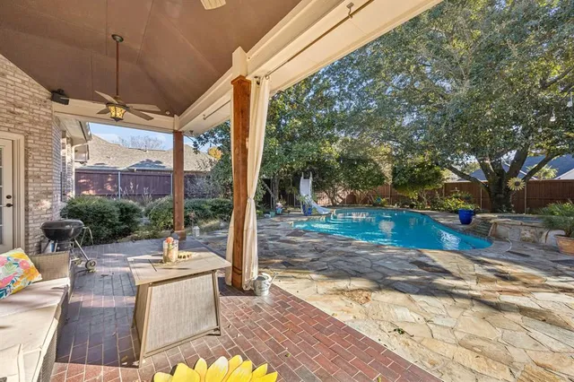 a view of a patio with a table chairs and a patio