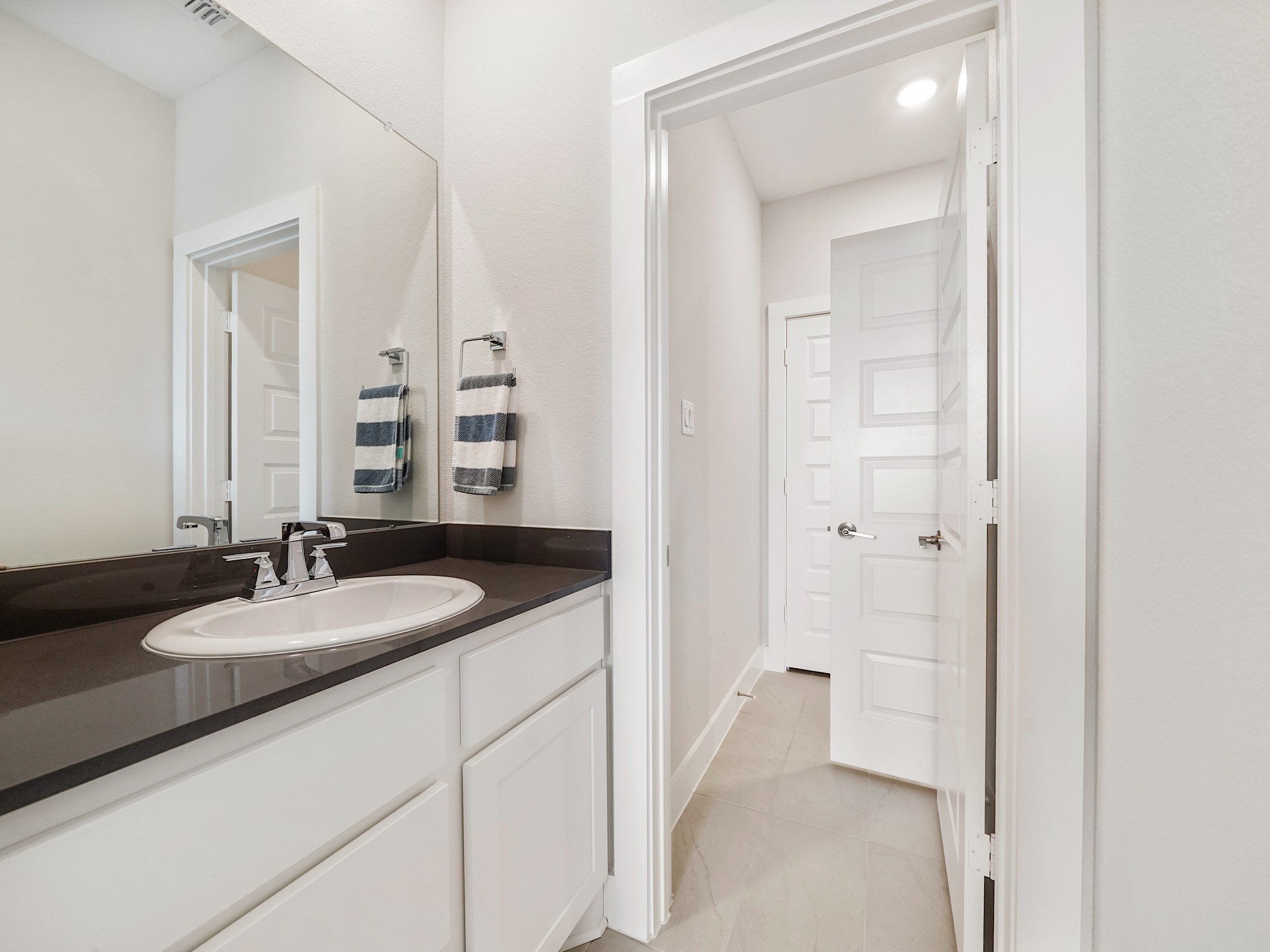 5802 Emerald Ranch Lane Fulshear, TX 77441 - Photo 37 of 45 The Jack-and-Jill bathroom features dual access, modern finishes, and generous vanity space, creating a functional and well-designed setup for shared living.