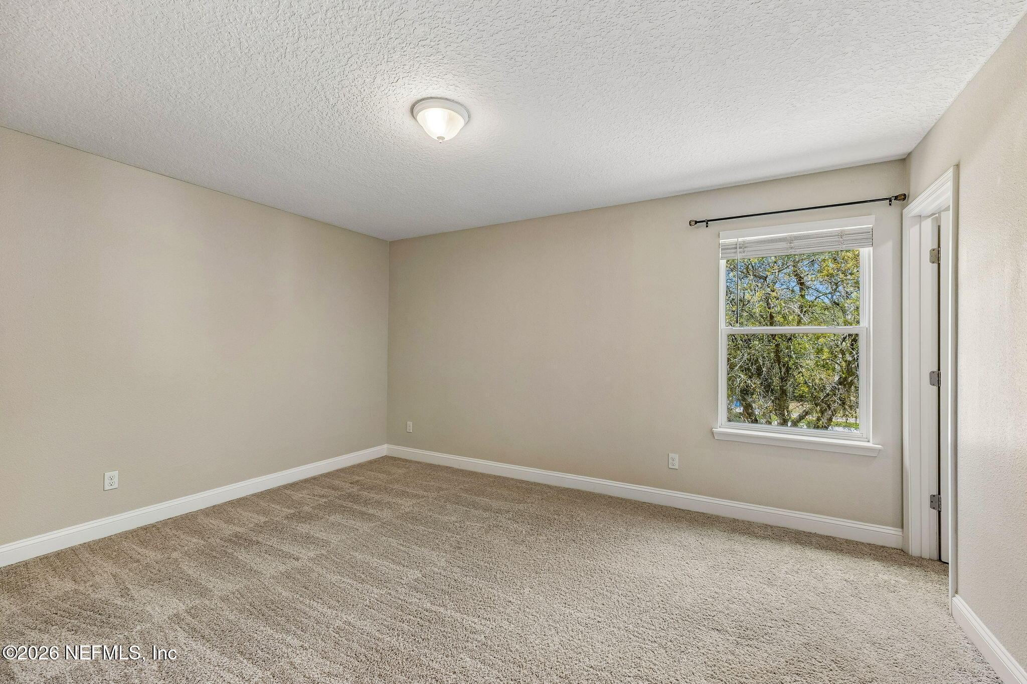 12198 Ridge Crossing Way Jacksonville, FL 32226 - Photo 36 of 67 an empty room with a window