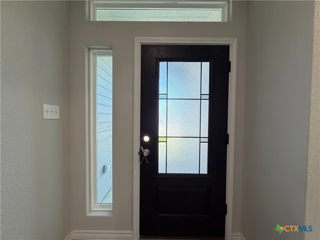 a view of a hallway with a door