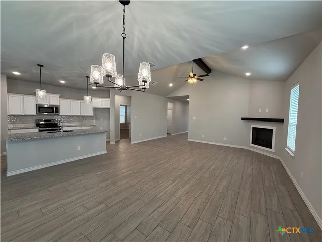 a view of a kitchen with microwave and stove