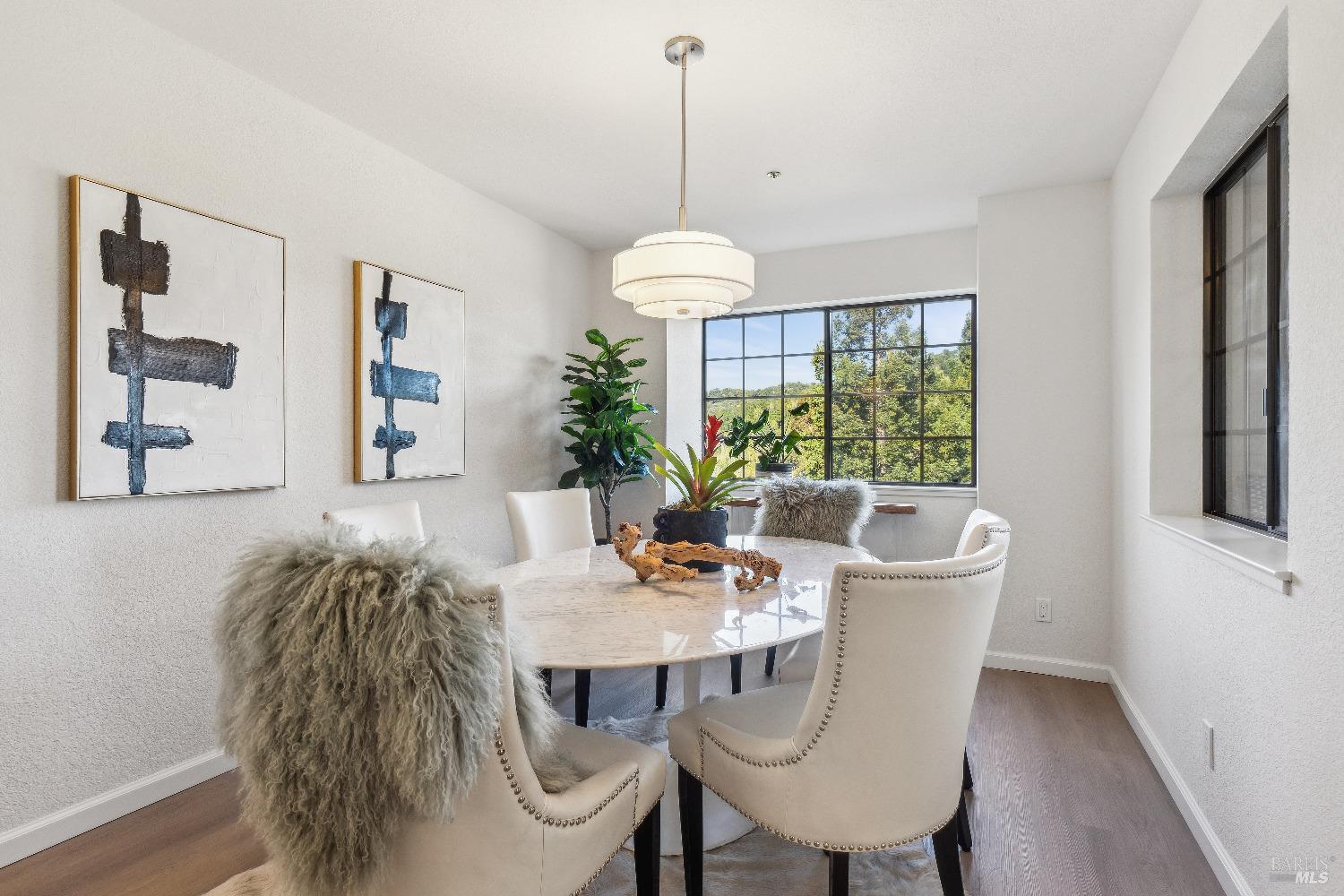 134 Redhawk Road Novato, CA 94949 - Photo 10 of 18 a dining room with furniture a chandelier and wooden floor