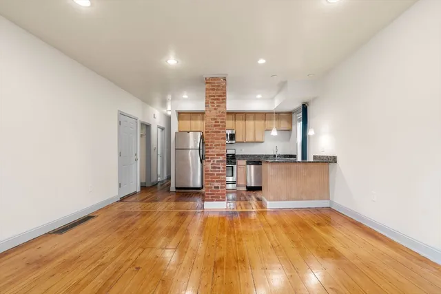 a view of kitchen with wooden floor