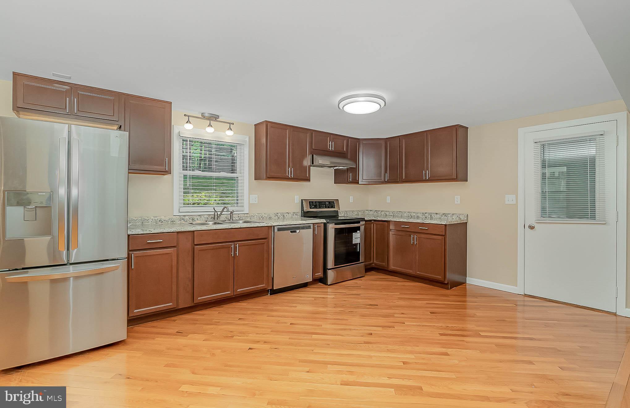 2603 Carrollton Road Finksburg, MD 21048 - Photo 10 of 37 Kitchen - Door Leads into Spacious Sun Room