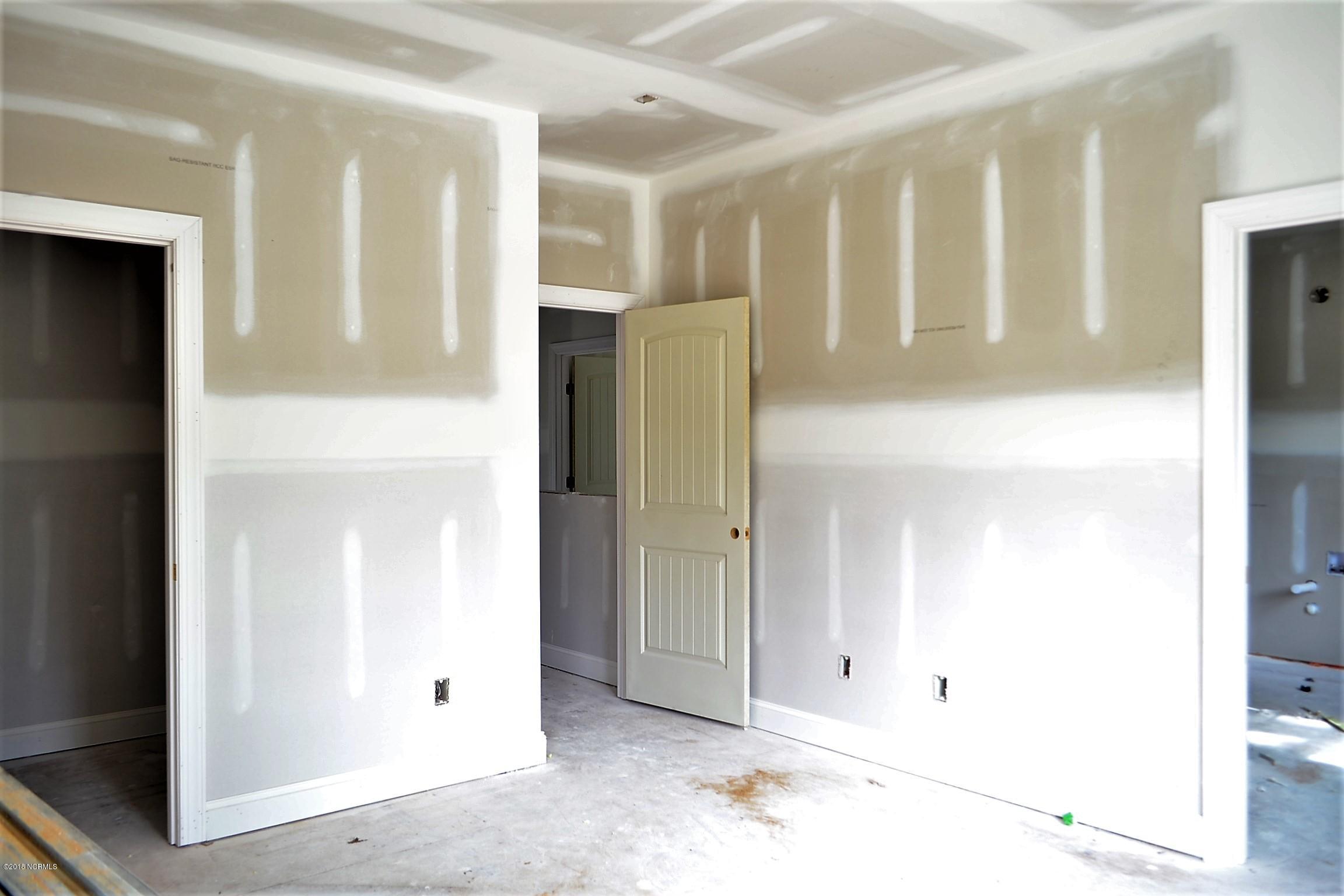 894 Hoover Road Hampstead, NC 28443 - Photo 13 of 16 Large master bedroom with attached bath and large walk-in closet