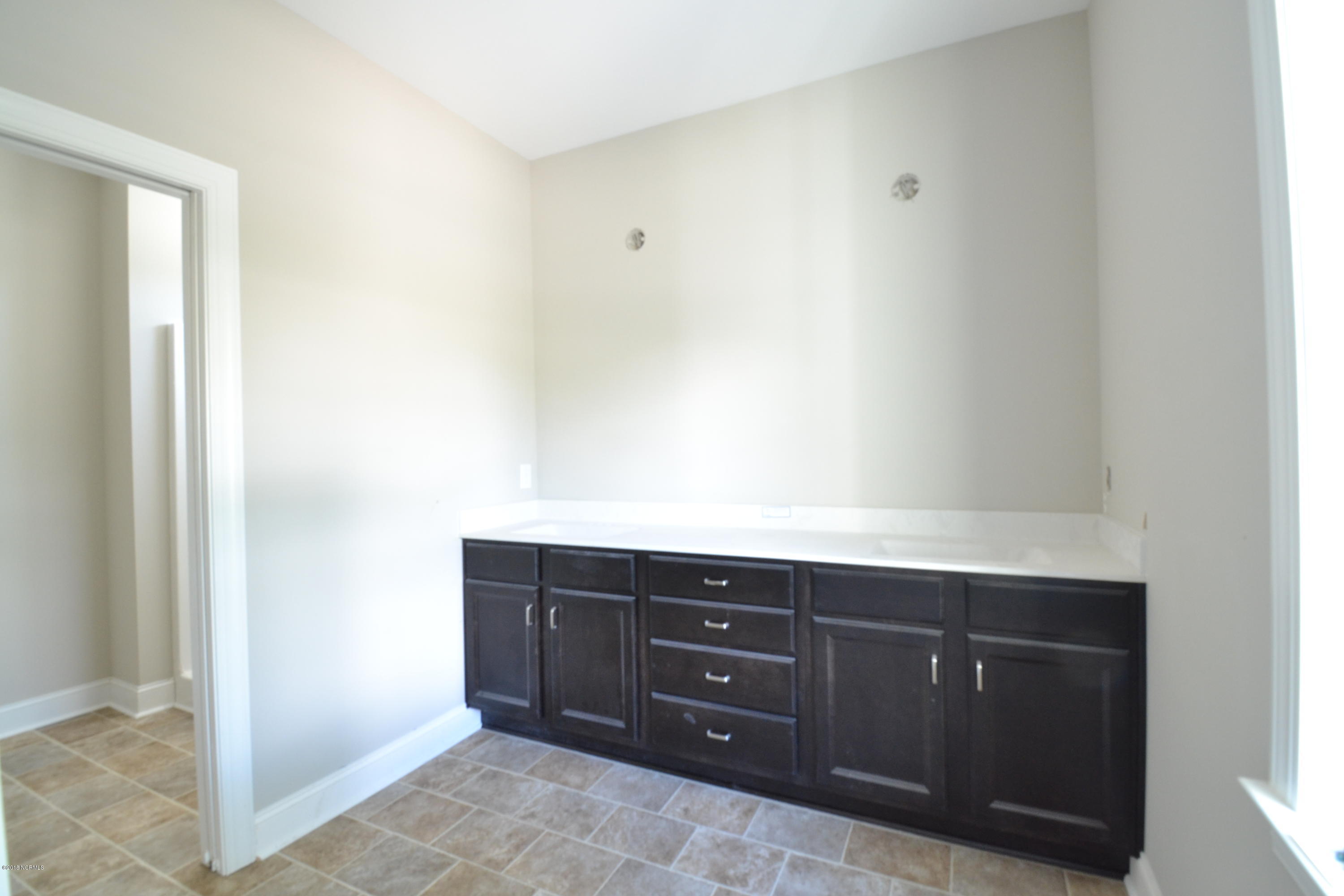 894 Hoover Road Hampstead, NC 28443 - Photo 14 of 16 HUGE master bath with separate vanity and bath areas
