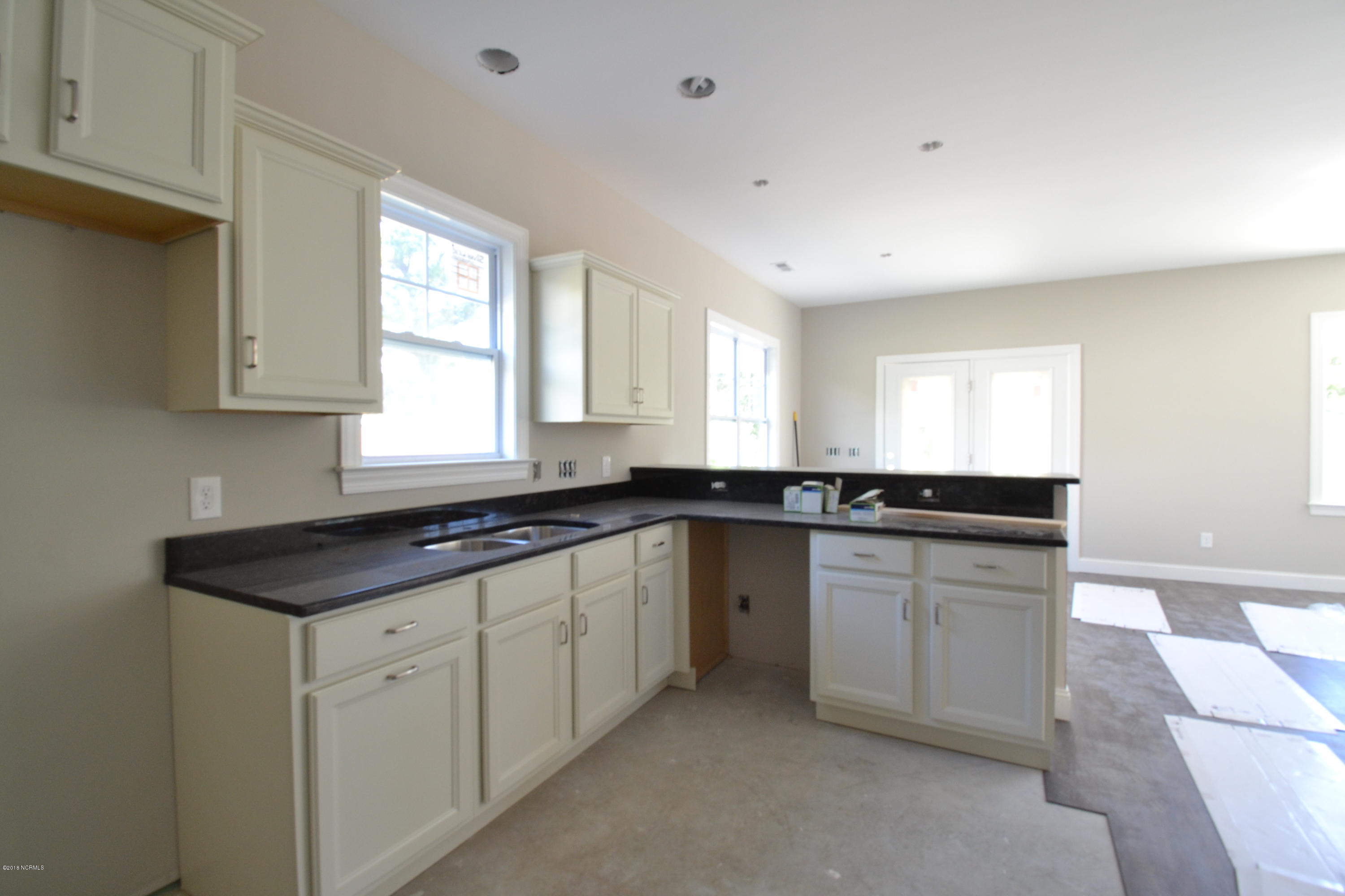 894 Hoover Road Hampstead, NC 28443 - Photo 6 of 16 Open kitchen with granite tops and will feature stainless appliances